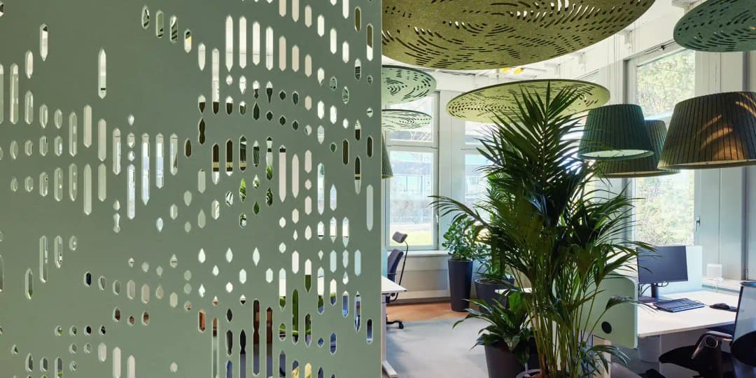 office environment with acoustic zones made from acoustic screens, desk dividers and acoustic ceiling rafts