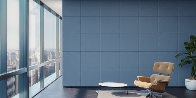 a modern waiting room with high rise views of the city. Single chair and table with sleek acoustic wall panels in blue