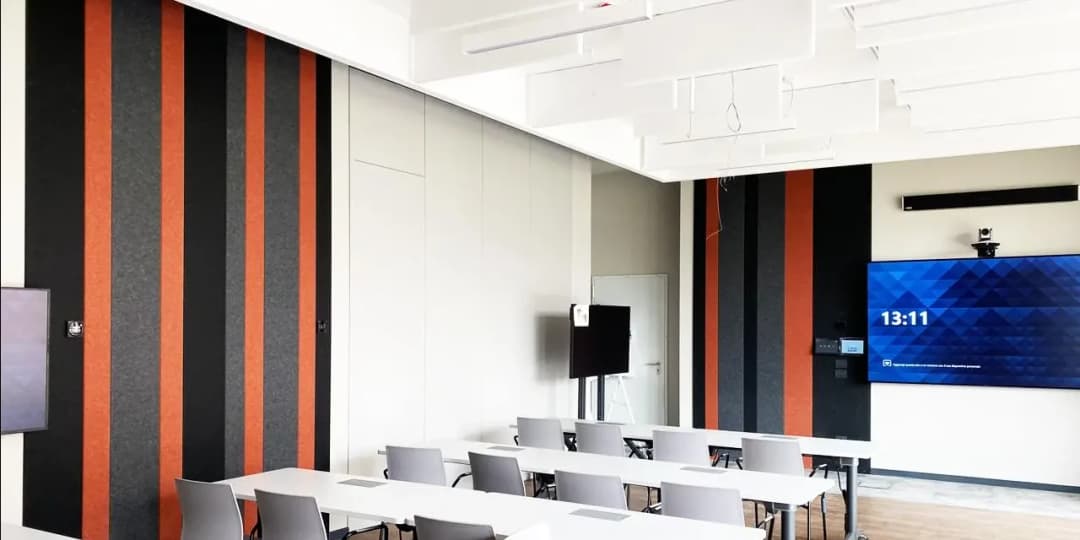 university seminar room with the ability to live stream lectures, has acoustic ceiling baffles and wall panels to absorb reverb