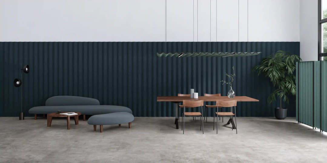 an acoustic manufacturers showroom, minimalist style with polished concrete floor and lots of corrugated acoustic panels on the ceiling and walls