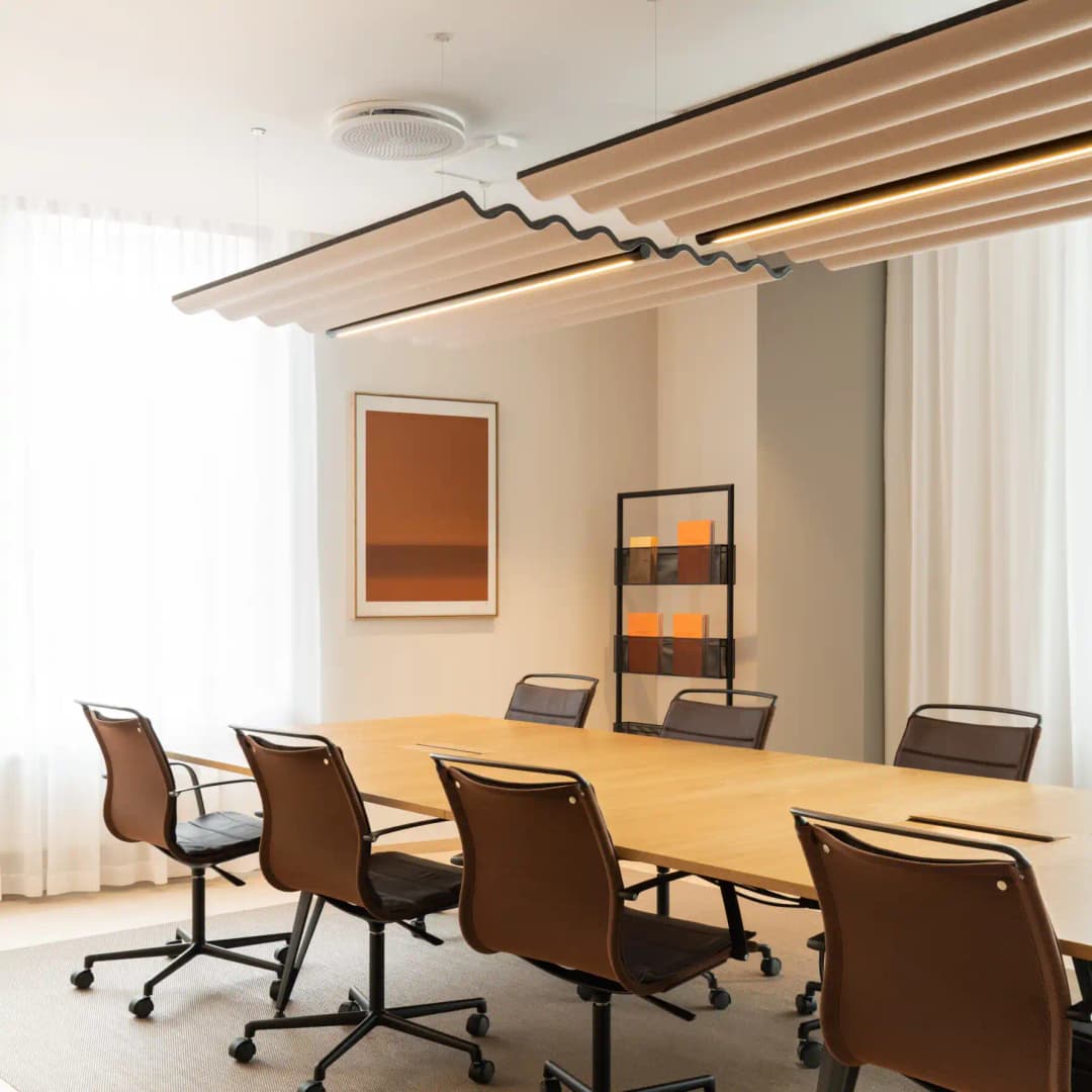 Scandinavian style meeting room with Abstracta Scala suspended acoustic ceiling raft with corrugated shape to it
